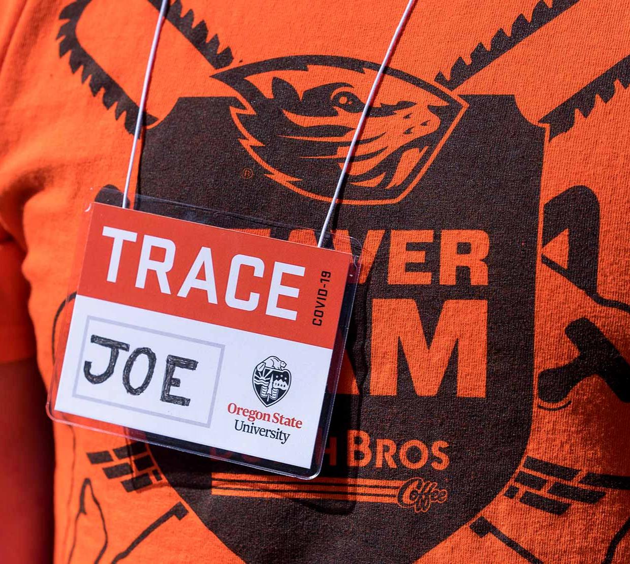 TRACE field staff member wearing OSU t-shirt and TRACE "JOE" name tag.