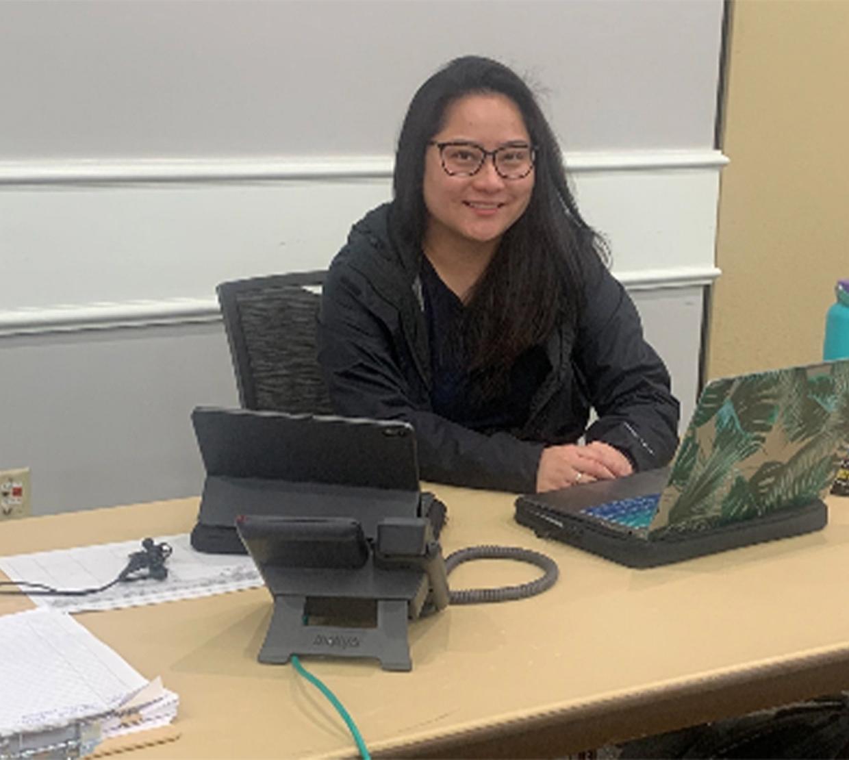 Marissa Song Mayeda working on homework at table.