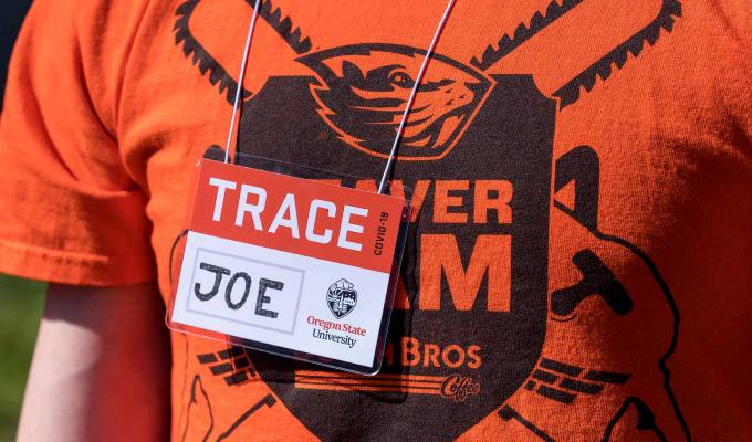 TRACE field staff member wearing OSU t-shirt and TRACE "JOE" name tag.